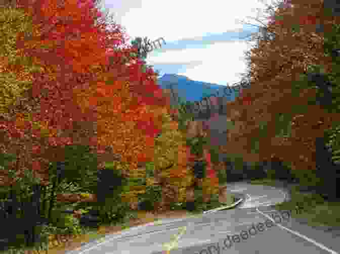 A Scenic View Of The Kancamagus Highway With Vibrant Fall Foliage And Mountains In The Background Maine S Most Scenic Roads: 25 Routes Off The Beaten Path