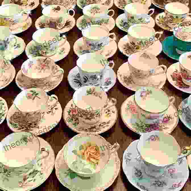 A Table Set With A Variety Of Teacups, Saucers, Pastries, And Sandwiches, With A Window Overlooking The Ocean In The Background Tea For Two At The Little Cornish Kitchen: A Brand New Heartwarming Read Set In Cornwall For 2024 (The Little Cornish Kitchen 2)