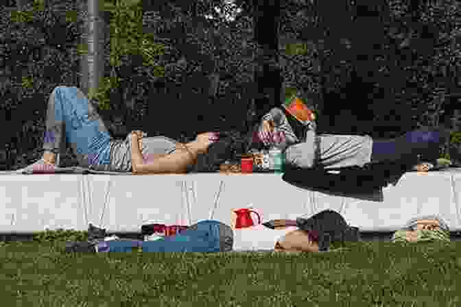 People Taking A Siesta In A Park On A Sunny Afternoon In Spain Greater Than A Tourist Barcelona Spain: 50 Travel Tips From A Local (Greater Than A Tourist Spain)